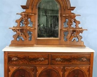 34 - Walnut Victorian marble top sideboard with carved fruit on doors, burl walnut trim and wood carved pulls, in great condition, 93 in. T, 62 in. W, 19 in. D.