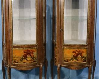 36 - Pair of matching pine curios with painted doors and bronze trim, 60 in. T, 24 in. W, 14 in. D.