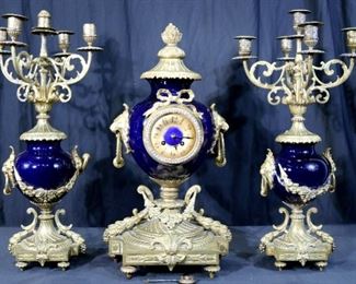2 - 3 Piece French clock set with 2 candelabras in blue porcelain and bronze, 22 in. T, 11 in. W, 10 in. D.
