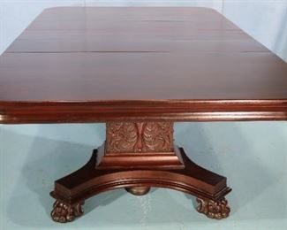 84 - Mahogany banquet table with 3 leaves, claw feet and acanthus carved base, 20 in. T, 86 in. L, 54 in. W.