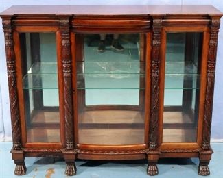 93 - Mahogany Empire acanthus carved crystal cabinet with mirror back, claw feet and curved front, 43 in. T, 54 in. W, 16 in. D.