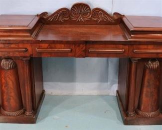 113 - Mahogany sideboard with exaggerated column ends, 4 drawers  and 2 doors, 45 in. T, 77 in. w, 25 in. D.