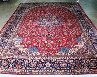 116 - Persian hand made rug in red, blue and beige, 13 ft. 6 in. x 9 ft. 6 in.