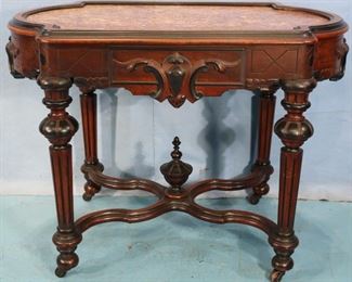 141 - Walnut Victorian inserted marble center table. Has crack in marble, 31 in. t, 41 in. W, 25 in. D.