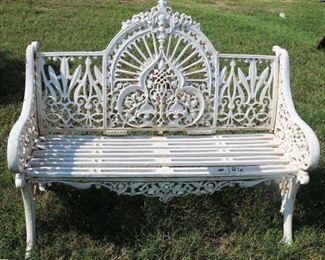 186 - White ornate cast iron bench, loveseat size with rounded gothic back, 37 in. T, 47 in. W, 22 in. D.