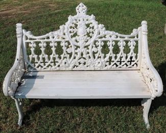 258 - White cast iron bench with shield back, wood seat and lion design in arm, 33 in. T, 44 in. W, 17 in. D. - Copy