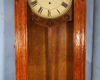 352 - Antique Gilbert wall clock with quarter sawn oak case and 8 day spring time, 43 in. T, 19 in. W, 8 in. D.