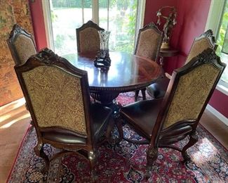 Round dining table with six chairs