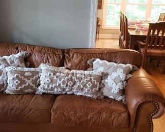 Leather sofa, pillows