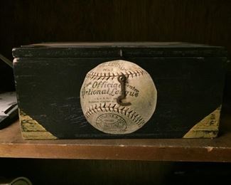 Small wooden box with baseball.