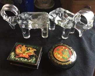 Glass elephant candlestick holders and trinket boxes.