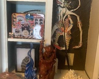 Coral pieces, Balinese puppet, wooden monk sculpture, mammoth tooth and petrified wood. Artwork not mine