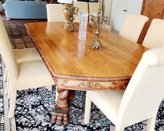 Oak dining room table , 8 parson chairs 
