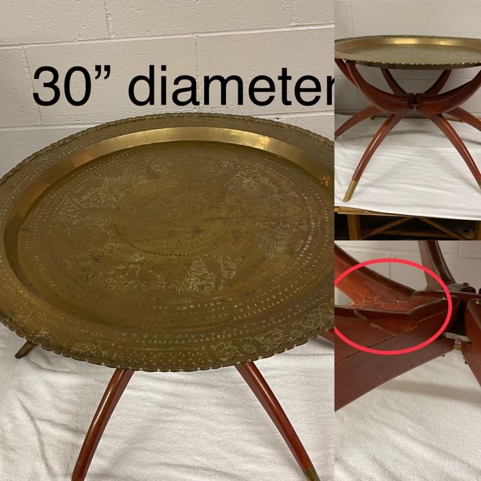 Brass top Spider table.  Legs fold and top can be hung as wall decor