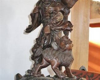 Important Antique Wood Carving of a Hunter with a Foo Dog