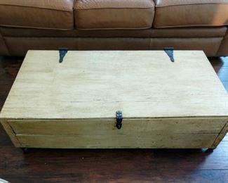 Primitive chest coffee table on castors