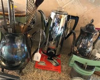 Nice percolator, silver pitchers.  Vintage cook ware and utensils.