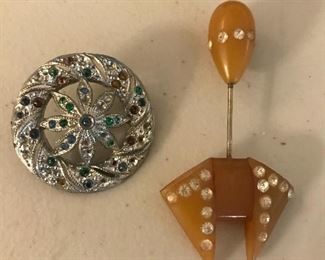 Love these Bakelite and rhinestone pin and part of a jewelry piece with stones.