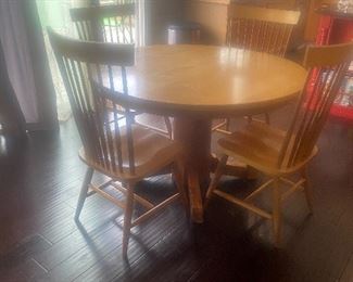 Round table with leaf and four chairs
