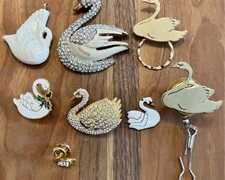 Assorted Swan Jewelry Including Rhinestone & Enamel Pins, Porcelain Pendant, Glasses Holder And More