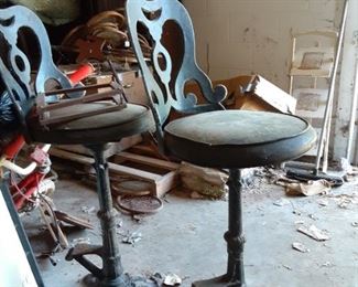 Four stools with cast iron stands