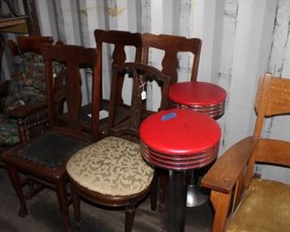 Assorted stools and wooden chairs