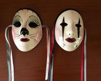 "Fancy Faces" porcelain masks Mardi Gras from New Orleans. (8" x 6" x 2" left & 7" x 6" x 2" right) Excellent condition and ready to wall mount. Asking $30 each. 
