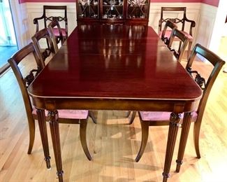 Stunning Mahogany dining room table w/ 8 chairs, including 2 captains chairs, upholstered seats