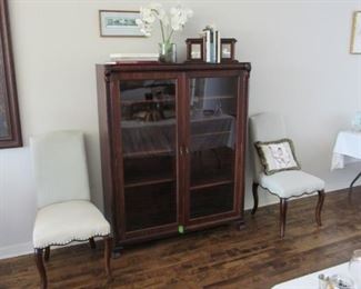 Antique walnut bookcase with glass doors