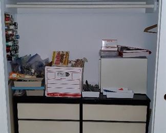sewing cabinet, patterns, yarn, games.