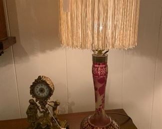 antique cranberry cut glass lamp with fringe shade, French table clock