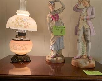 hurricane lamp and bisque statues