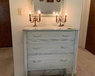 antique dresser on legs, candleabras, antique mirror