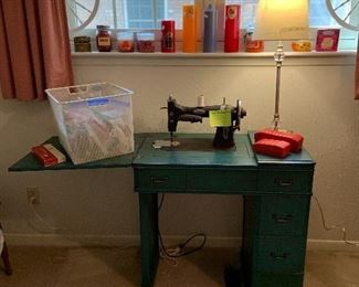White sewing machine and table, works