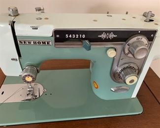 #36	Cabinet	New Home Metal Sewing Machine in Machine	 $ 50.00 																						