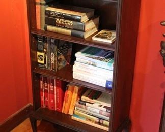 #24 Bar/Bookcase with serpentine top shelf and gallery fretwork rim.  C. 1930.    45.5” X 22” X 11.5” 