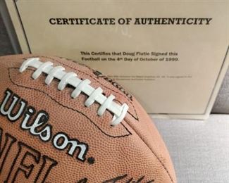 SIGNED DOUG FLUTIE WITH CERTIFICATE OF AUTHENTICY - SIG. FADED BUT VISIBLE