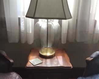 Upholstered chairs, table and lamp.