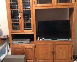 Beautiful entertainment center. Light colored wood