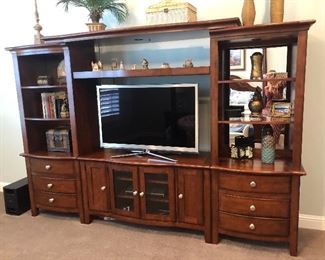 Entertainment center with many drawers and shelves