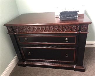 This is a lateral file cabinet in like new condition, solid wood