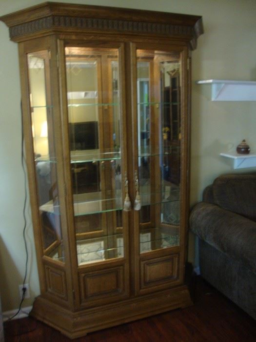 Large oak lighted cabinet with mirror back
