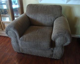 One of two upholstered arm chairs