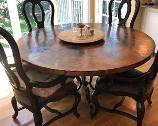#1) - $1500 - Seville Home Copper Top Dining Table with 6 Chairs.  Each chair is solid wood with a leather seat bottom.  Table is 60 Inch in diameter.  Table new was $3500 and chairs were $400 each.  