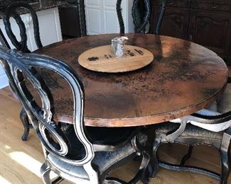 #1) - $1500 - Seville Home Copper Top Dining Table with 6 Chairs.  Each chair is solid wood with a leather seat bottom.  Table is 60 Inch in diameter.  Table new was $3500 and chairs were $400 each.  