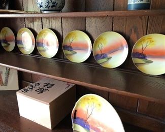 #108) - $70 - Set of 7 Hand Painted in Japan Meito China Plates.  