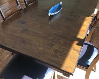 #100) - $750 - Solid wood table with 6 Chairs. 20 Inch leaf folds into table to expand an additional length.  Custom protective pads for entire table.  40" x 72" collapsed.  40" x 92" expanded.  