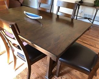 #100) - $750 - Solid wood table with 6 Chairs. 20 Inch leaf folds into table to expand an additional length.  Custom protective pads for entire table.  40" x 72" collapsed.  40" x 92" expanded.  
