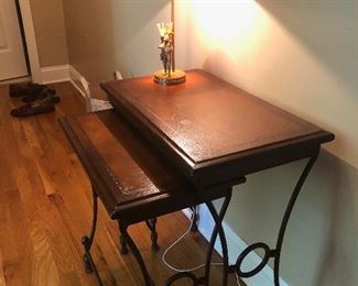 #24) - $200 - Set of 2 Nesting Tables.  Iron Frame.  Wooden Top with Leather Inlay.  