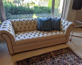 Faux leather chesterfield loveseat